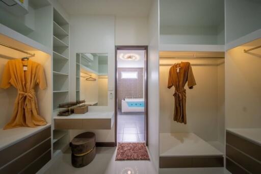 Spacious walk-in closet with view of the bathroom