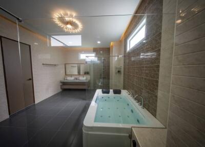 Modern bathroom with a Jacuzzi tub and dual sinks