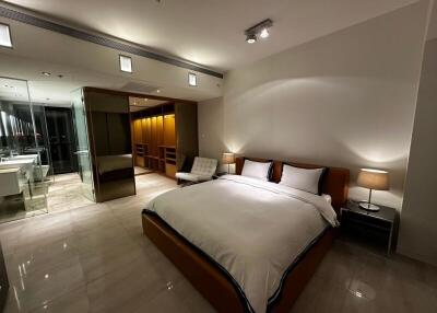 Modern bedroom with ensuite bathroom and walk-in closet