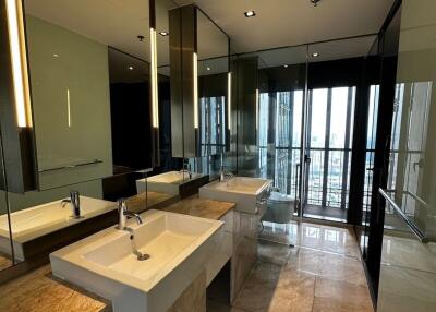 Modern bathroom with dual sinks and large mirror
