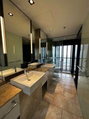 Modern bathroom with dual sinks and large mirror