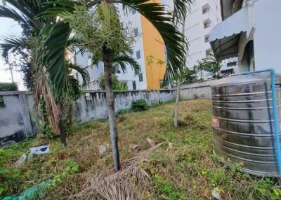 Backyard with trees and a water tank