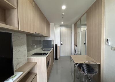 Modern kitchen with wooden cabinets and dining area