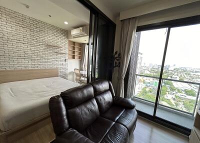 Modern bedroom with large windows and city view