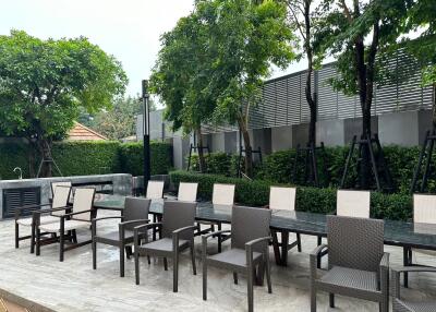 Spacious outdoor seating area with tables and chairs