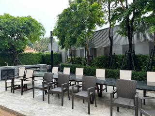 Spacious outdoor seating area with tables and chairs