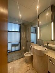 Modern bathroom with large mirrors and contemporary fixtures