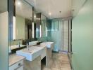 Modern bathroom with dual sinks and large mirrors