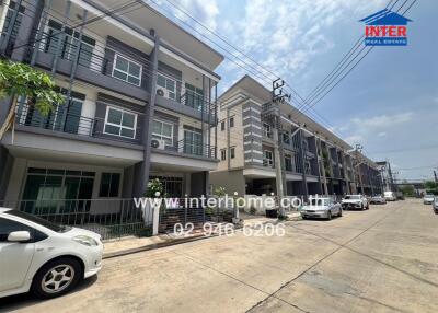 Street view of modern multi-story residential buildings