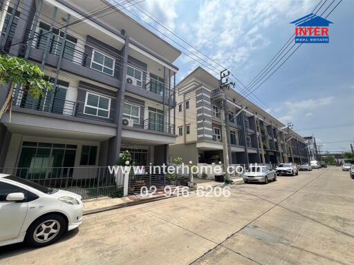 Street view of modern multi-story residential buildings