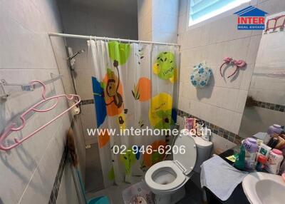 Bathroom with shower, toilet, and sink