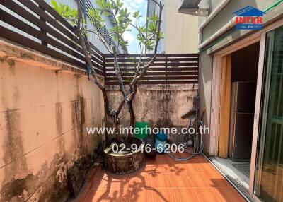 Outdoor area with tree and tiled flooring