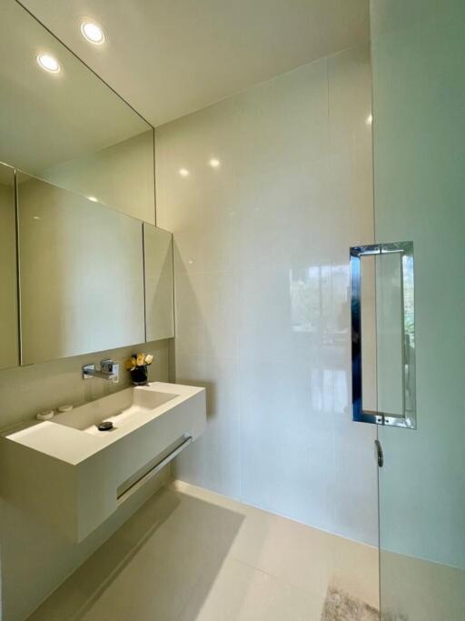 Modern bathroom with floating vanity and large mirror