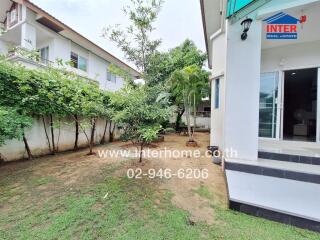 Exterior view of a house with garden and patio