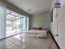 Bedroom with large window and sliding glass door to patio