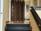 Indoor staircase with wooden floors and decorative screen