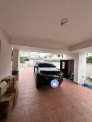 Garage with parked car and storage boxes