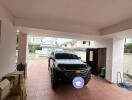 Garage with parked car and storage boxes