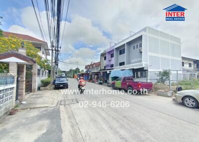 Street view of residential area with multi-story houses