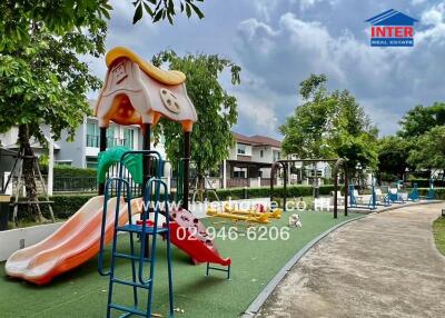 Outdoor playground with slide and swings in a residential area