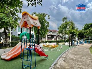 Outdoor playground with slide and swings in a residential area