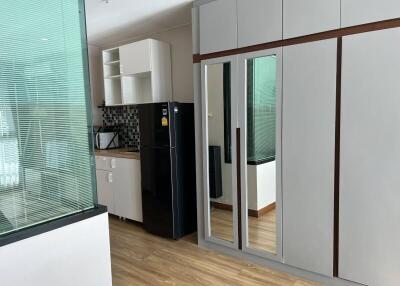 Modern kitchen with integrated appliances and built-in cabinets