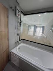 Modern bathroom with a bathtub and a view through a window