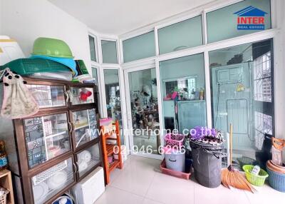 Kitchen area with storage and household items