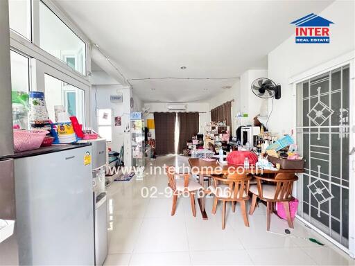 Modern kitchen with dining area and various appliances