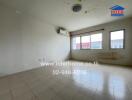 Unfurnished living area with air conditioning and tiled floor