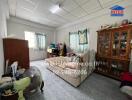 Bedroom with basic furnishings and natural light