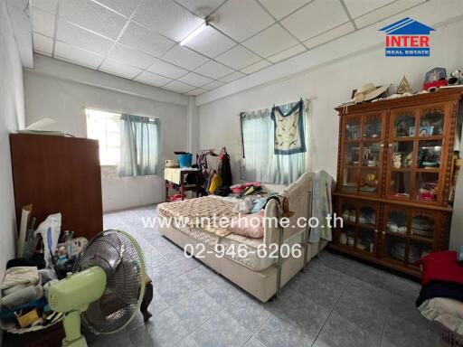 Bedroom with basic furnishings and natural light