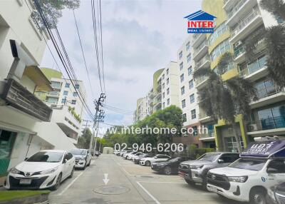 Exterior view of residential buildings with parked cars