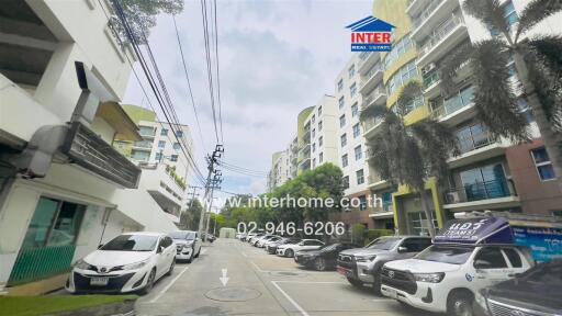 Exterior view of residential buildings with parked cars