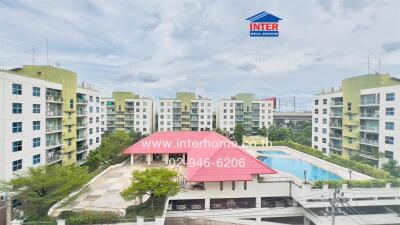 View of apartment complex with swimming pool