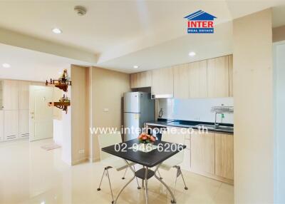 Modern kitchen area with dining table