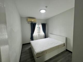 Minimalist bedroom with bed and window