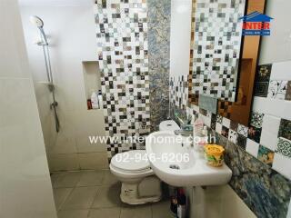 Bathroom with tile design and shower