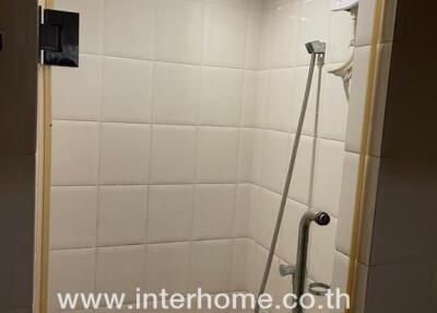 Shower area with grab bar