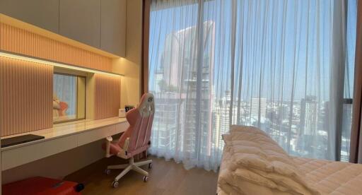 Modern bedroom with large window and city view