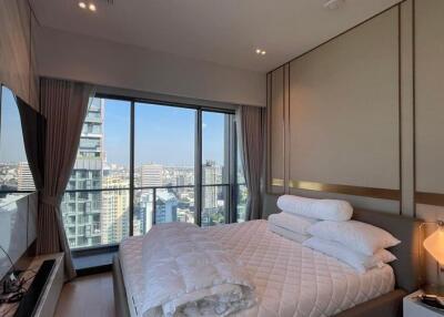 Modern bedroom with city view and large window