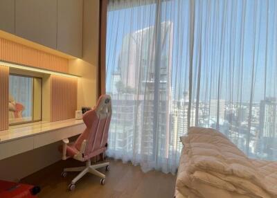 Modern bedroom with window showcasing city view