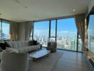 Spacious living room with large windows and city view