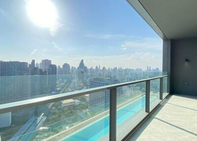 City view from the balcony with glass railing and sunshine