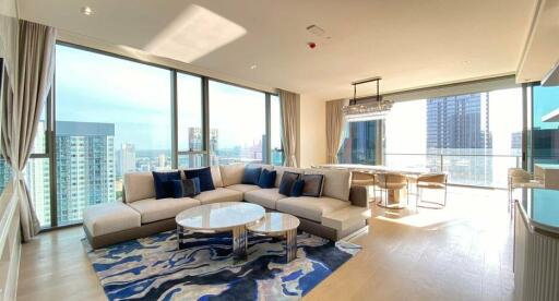 Modern living room with large windows and a city view