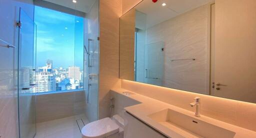 Modern bathroom with large window and city view