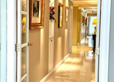 well-lit hallway with framed art and decorative accents