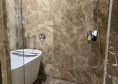 Modern bathroom with marble walls and floor