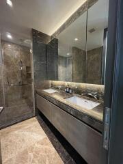 Modern bathroom with double sinks and large mirror