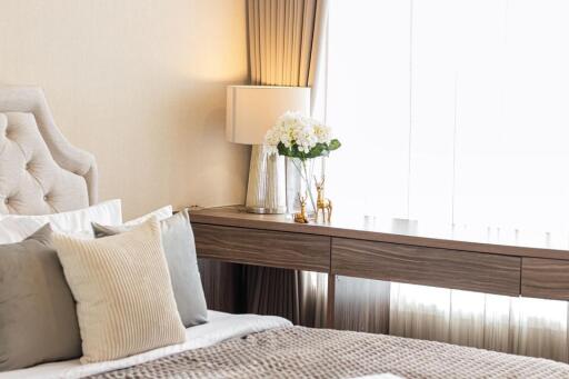 Well-lit, modern bedroom with decorative accents